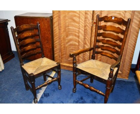 A set of six Lancashire ladder back chairs, each with shaped horizontal splat, rush seat, raised on turned legs terminating i