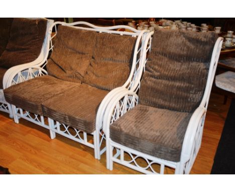 A white painted caned conservatory sofa and armchair, each with loose cushioned back and seat, 125cm wide (2)