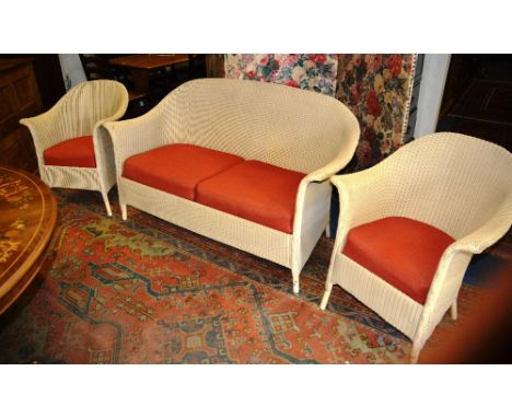 A Lloyd Loom three piece suite, comprising of two seater sofa and pair of tub chairs, 146cm wide (3)