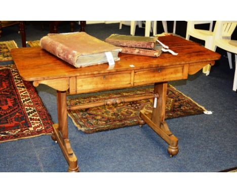 A Regency mahogany fixed sofa table, the rounded rectangular top over two short frieze drawers flanked by scroll brackets rai