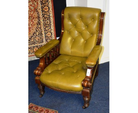 A Victorian mahogany and olive leather button back armchair, the scroll cushion back on reeded supports, cushioned arms on ba