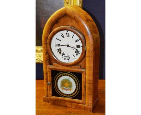 An American eight day mantle clock, by EN Welch, Conn. USA, the Gothic arched case with circular face, Roman numerals, painte