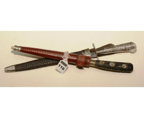 An Indo Persian dagger kard, with horn grip decorated with white metal flowerheads, the blade etched with silver and bone mou
