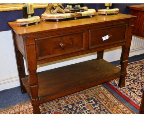 A Continental oak buffet, the rectangular top over two beaded short drawers, raised on baluster legs, united by shelf, 134cm 