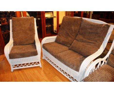 A white painted caned conservatory sofa and armchair, each with loose cushioned back and seat, 130cm wide (2)