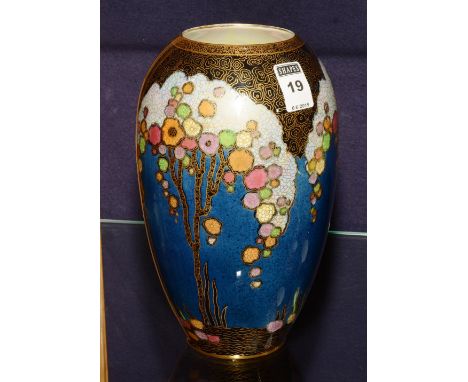 A Crown Devon oviform lustre vase, with enamel and gilt decoration on a blue ground, 24cm high