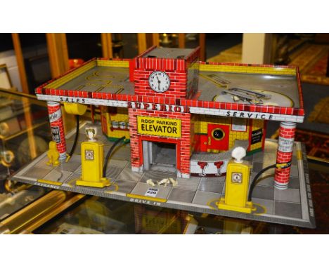 A Met Toy Superior Service Station, with BP and Shell pumps, 63cm wide x 26cm high x 41cm deep CONDITION REPORT: Lot 229 - Th