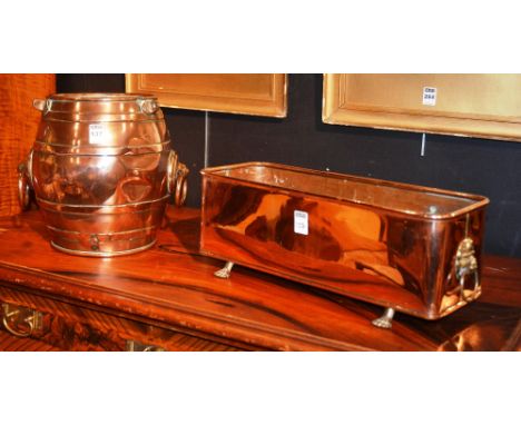 A copper mounted barrel, with ring handles, 27.5cm high, together with a copper planter, small copper jug and two enamel dres