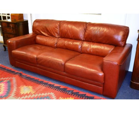 A Violino leather three seater sofa, with loose cushion seat, 220cm wide x 95cm high x 100cm deep