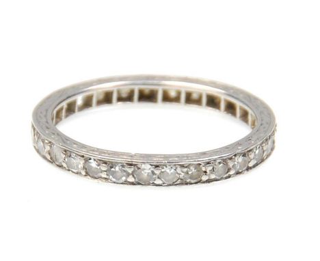 A 9ct white gold ladies diamond eternity ring set with twenty-five round cut diamonds and engraved decoration to the sides (s