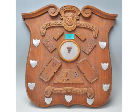 A vintage wooden wall&nbsp; plaque British Brewood Cannock Sports Trophy of armorial shield form having applied wooden detail