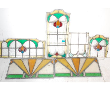A good group of early 20th Art Nouveau stained led lined glass windows having. Together with two Art Deco examples. 66cm x 27