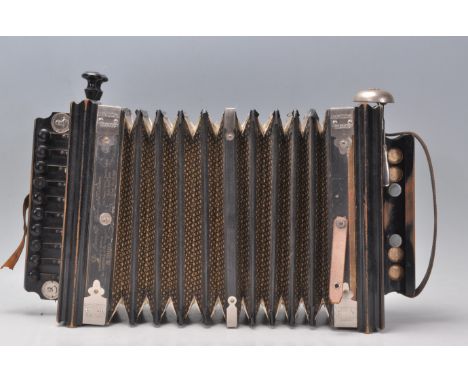 An early 20th Century Edwardian Campbell's Royal Champion Melodeons Accordion constructed from ebonised wood with gilt star d