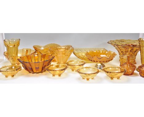 A group of early 20th Century Art Deco 1930's orange glassware with some frosted examples to include decorative vases and dis