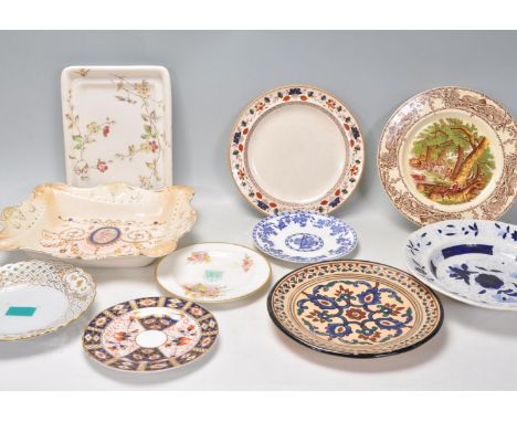 A mixed group of English china cabinet plates and dishes to include a gilt ribbon plates, Clarice Cliff Rural Scenes plate, R