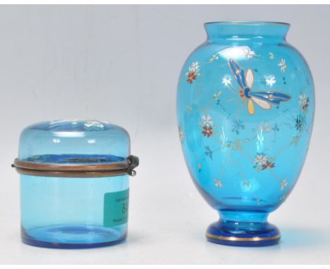 Two vintage blue glass hand enamelled ceramics in the manner of Moser to include a cylindrical trinket box decorated with a b