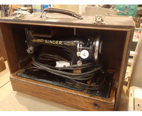 Cased electric Singer sewing machine    CONDITION REPORT:  This item has been PAT tested and PASSED. PAT testing does not gua