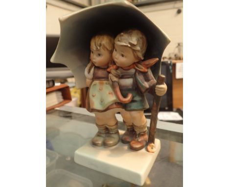 Hummel figurine of children under umbrella