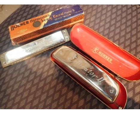 Hohner harmonica song band and two Hohner Educator II harmonica both in cases