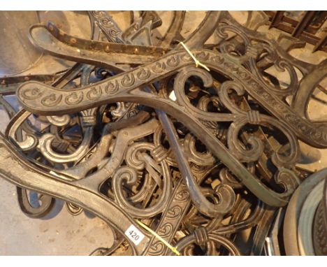 Four pairs of cast iron bench ends