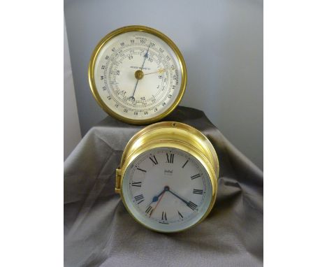 Sestrel brass-cased alarm clock in the style of a Ships Bulkhead clock along with a brass cased round Aneroid Barometer