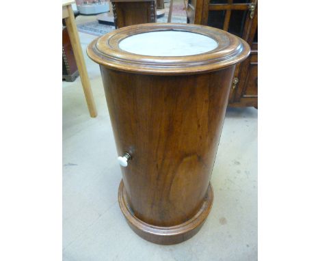 Fine example of a Victorian Mahogany pot cupboard of cylindrical form with marble inset, opening door to reveal one shelf. 