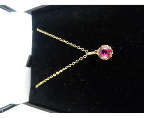 9ct Gold Ruby solitaire pendant hung on a 16" chain. The claw set Ruby measures 5.3mm in diameter Gross Weight 1.6g