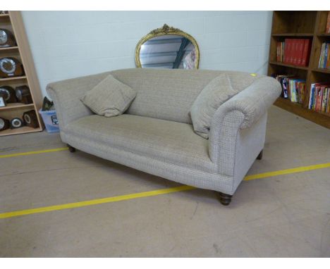 Modern large two seater deep sofa upholstered in beige and green fabric