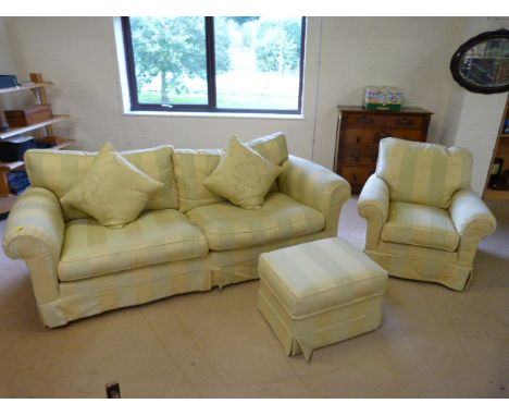 Large two seater green and cream upholstered settee with matching pouffe and armchair