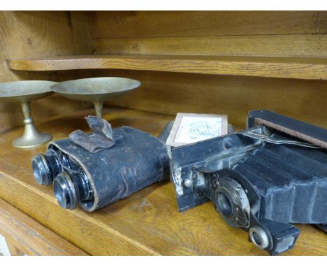 Kodak Automatic Folding brownie camera, Pair of possibly German binocluars in case with no cover, pair of miniature brass Taz