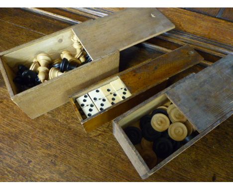 Three vintage games - dominoes, checkers, and chess