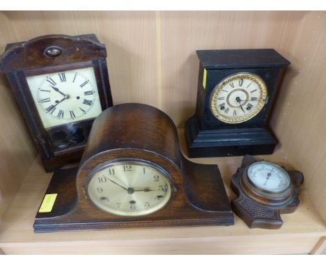 Three various mantle clocks - sloped oak mantle clock, Ansonia american mantle clock and one other. Along with a carved anero