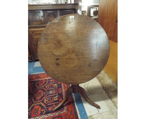 An Early 19th Century Tripod Table with Circular Oak Top over a Central Turned Column and Outswept Legs. 76cm Diameter, 72cm 