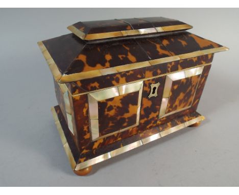 A Tortoiseshell and Mother of Pearl Two Division Tea Caddy on Bun Feet. 19cm Wide. 