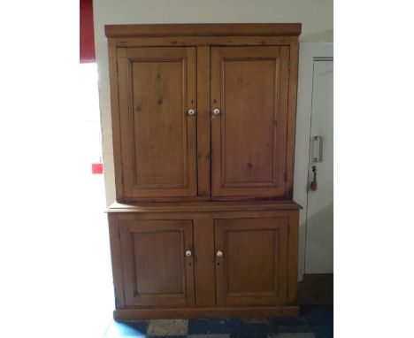 A 19th Century Pine Housekeepers Cupboard with Panelled Doors to Base Cupboards with Single Shelf and Shelved Top Section.