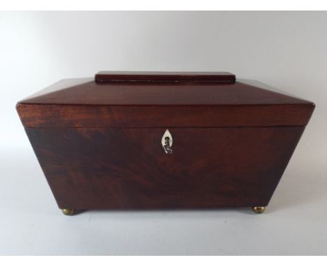 A 19th Century Mahogany Sarcophagus Tea Caddy with Bun Feet. 16.5 Cm High. 