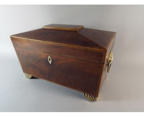 A Regency Sarcophagus Shaped Mahogany Tea Caddy with Brass Ring Carrying Handles and Brass Bracket Feet. Two Inner Tea Boxes 