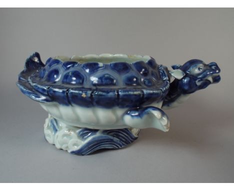 A Japanese Blue and White Ceramic Bowl in The Form of a Turtle Swimming Over Wave. 26 Cm Long. 