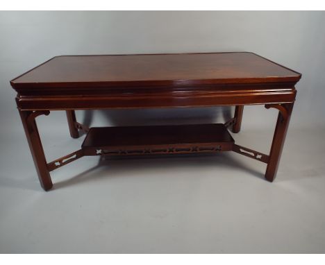 A Contempoary Mahogany Rectangular Coffee Table with Strecher Shelf.