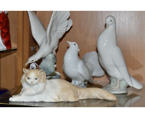TWO LLADRO DOVES, A NAO DOVE AND A NAO CAT, comprising Lladro Turtle Dove, model no 4550, perched on leaves with wings raised
