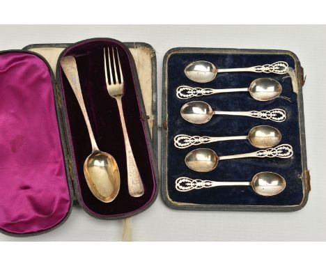 A GEORGE V CASED SET OF TEASPOONS AND VICTORIA I CASED CHRISTENING SET, a set of six tea spoons detailed with a husking desig