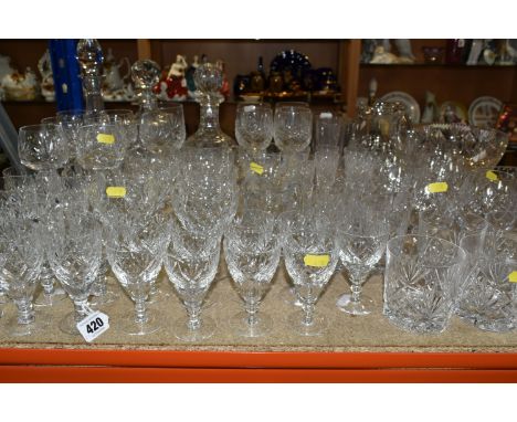 A COLLECTION OF CUT CRYSTAL, all of a similar pattern comprising a set of six white wine glasses, six short stemmed red wine 