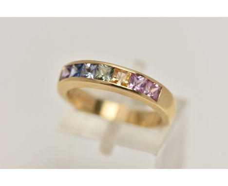 AN 18CT GOLD MULTI GEM RING, set with seven square cut gems in a channel setting, including sapphire and ruby, 18ct hallmark 