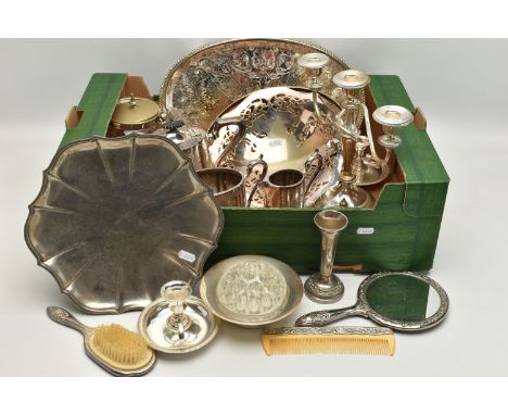 A BOX OF MAINLY SILVER PLATED WARE, to include a pair of chambersticks, a dressing table set, a candelabra, oval tray, teapot