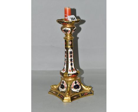 A ROYAL CROWN DERBY OLD IMARI 1128 SOLID GOLD BAND  CANDLESTICK, heavily gilded with dolphin detail to square base, red print