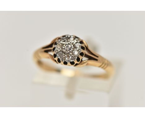 A YELLOW METAL DIAMOND CLUSTER RING, small circular cluster of single cut diamonds, within an openwork mount and trifurcated 