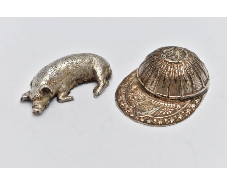 A SILVER 'FRANCIS HOWARD' CADDY SPOON AND A WHITE METAL PIG FIGURINE, the caddy spoon in the form of a jockeys hat with a vac