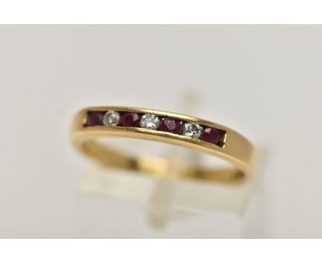 AN 18CT GOLD RUBY AND DIAMOND SEVEN STONE RING, designed as four circular rubies interspaced by three brilliant cut diamonds 