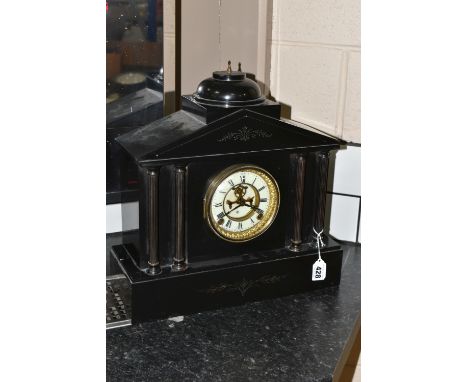 A 19TH CENTURY BLACK SLATE MANTEL CLOCK, architectural form, with four columns to the front, gilt bezel, enamel chapter ring 