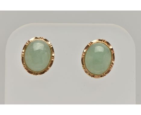 A PAIR OF YELLOW METAL JADE STUD EARRINGS, of an oval form, set with an oval cut jade cabochon, collet set stamped 585, to th